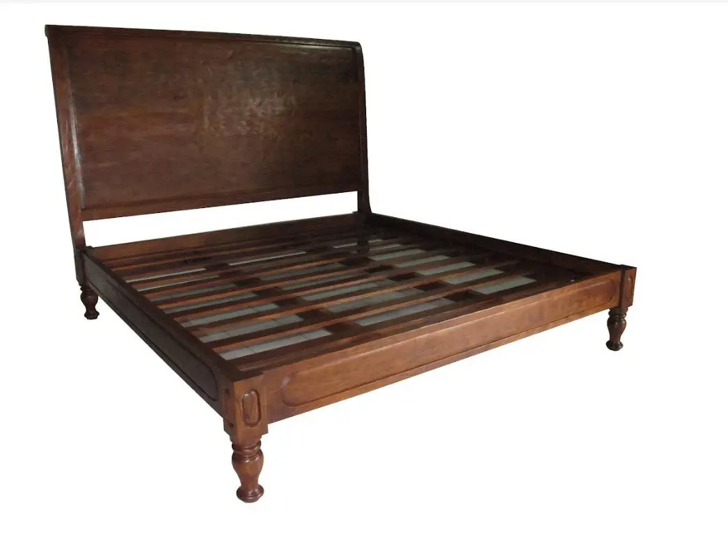 Wooden bed frame with headboard and slats.