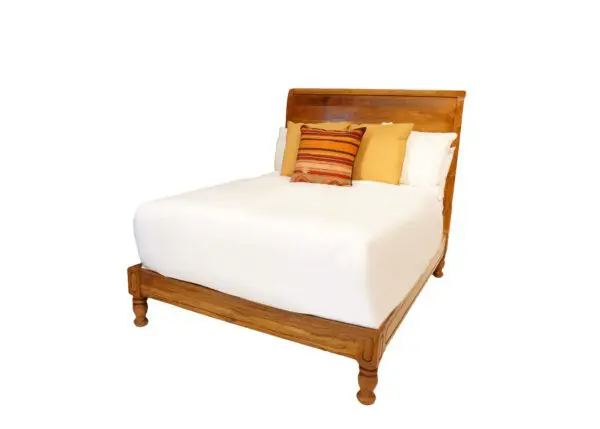 Wooden bed with colorful decorative pillows.