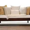A couch with many pillows on it