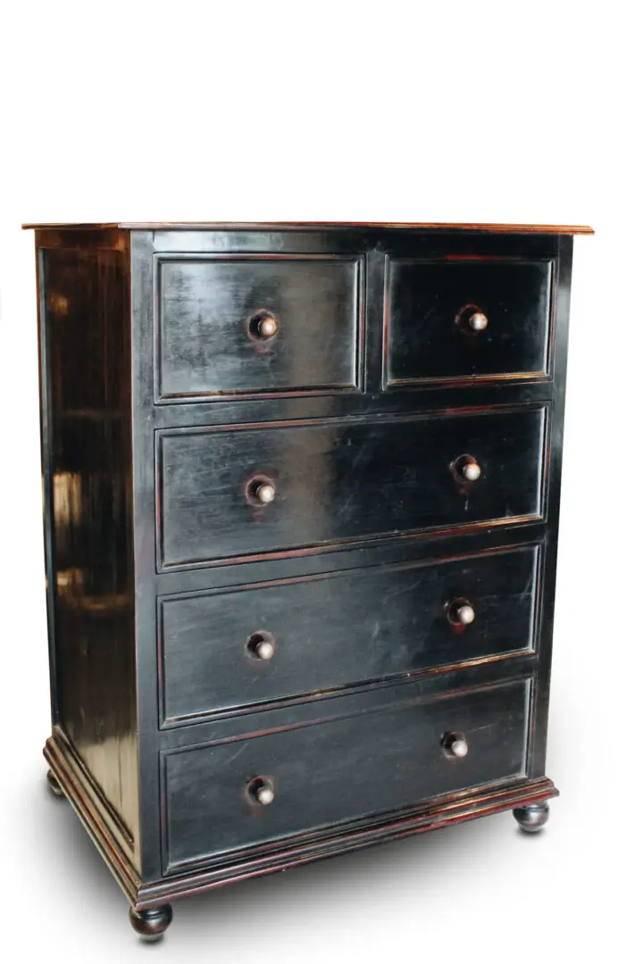 Black wooden chest of drawers.