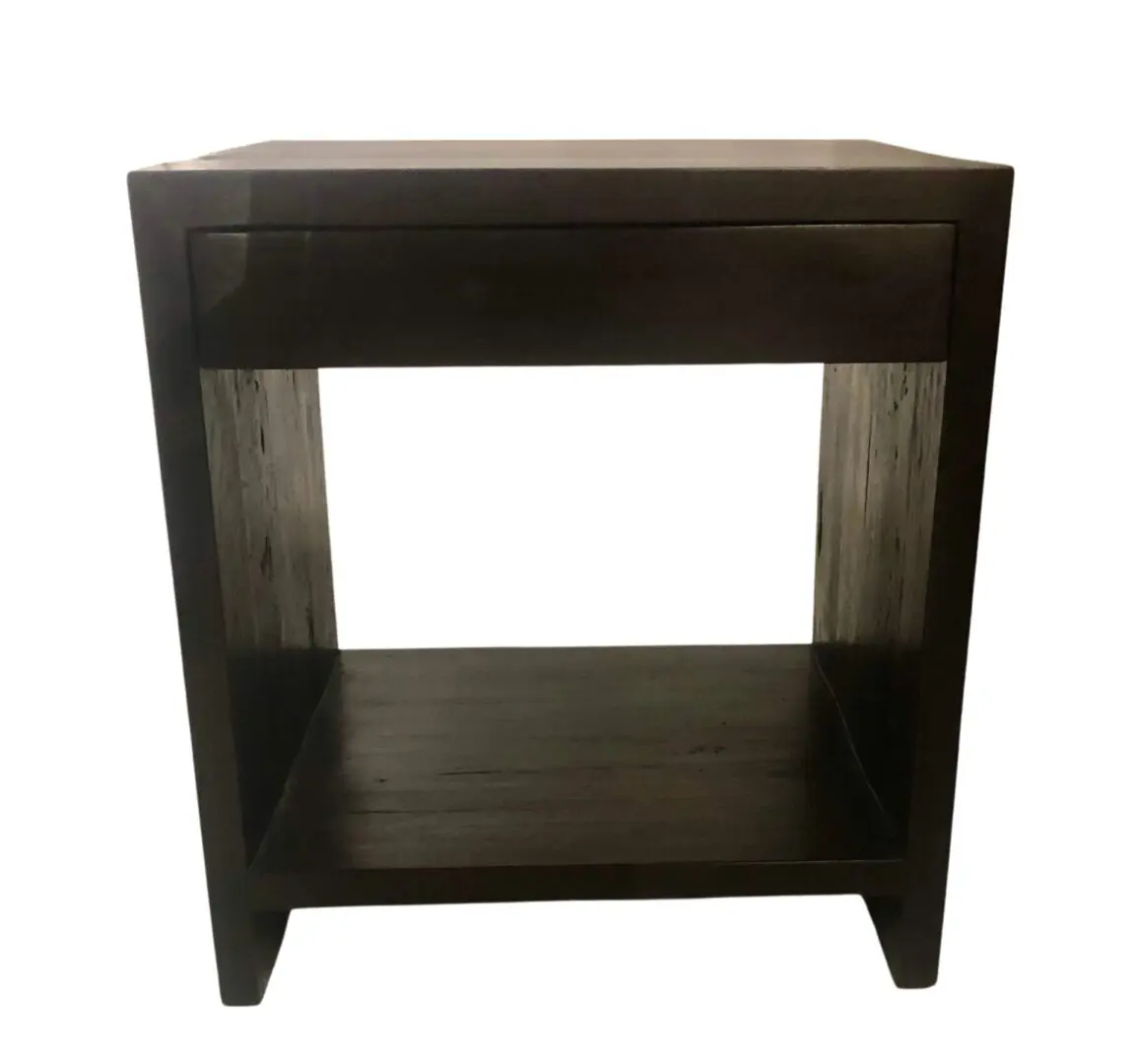 Dark wooden end table with drawer and shelf.