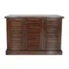 Wooden cabinet with louvered doors.