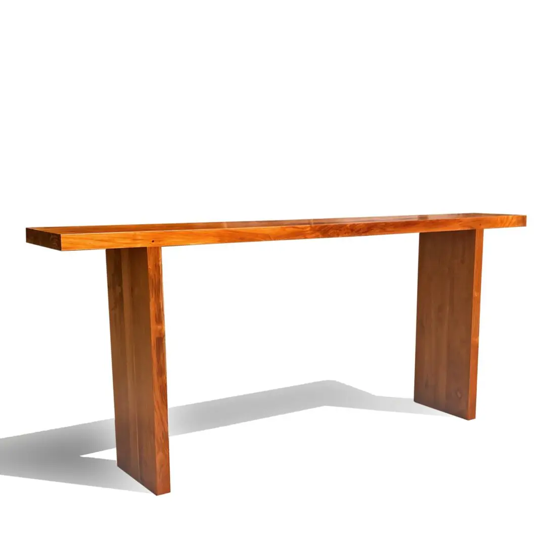 Wooden console table with a single leg on each side.