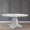 A white table with a gray wall behind it