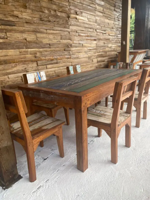 A table and chairs set up outside in the sun.