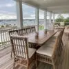 A large wooden table with chairs on top of it.