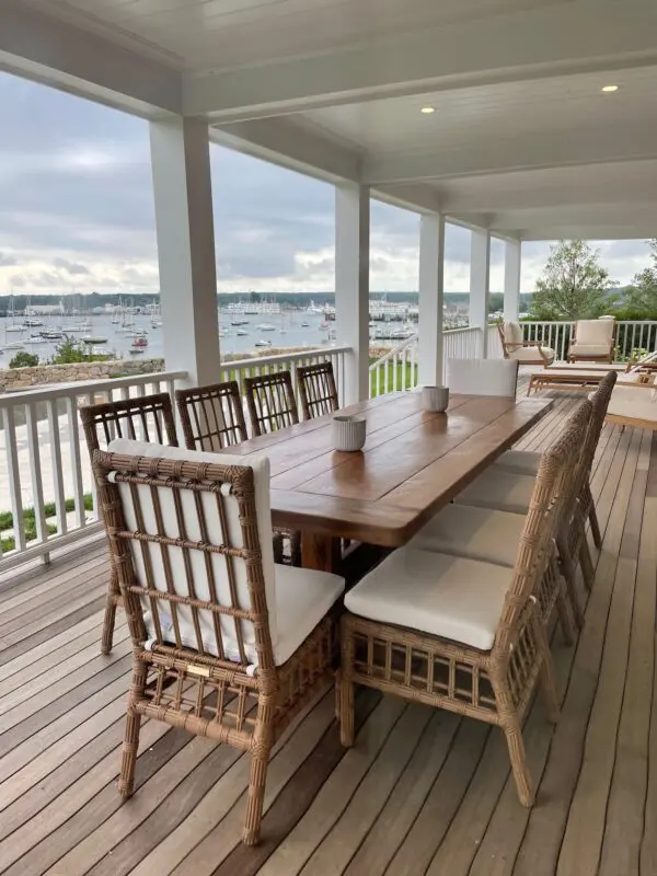 A large wooden table with chairs on top of it.