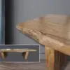 A wooden table with a picture of the top and bottom.