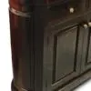 A close up of the door on a wooden cabinet