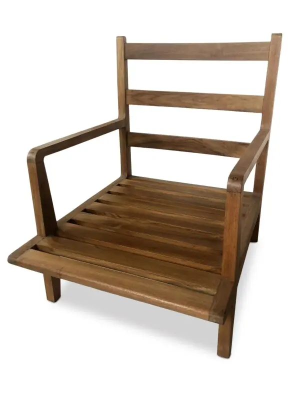 A wooden chair with a foot rest on top of it.