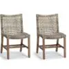 A pair of chairs with woven seats and backs.