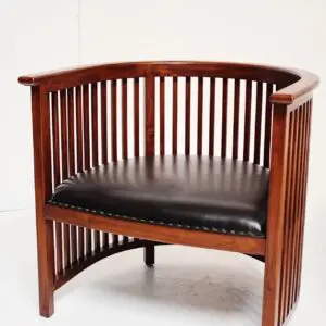 A wooden chair with black leather seat.