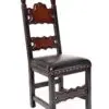 A chair with black leather seat and wooden back.