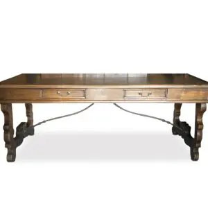 Wooden table with two drawers and ornate legs.