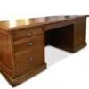 Wooden desk with multiple drawers.