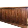 Wooden furniture piece with vertical panels.