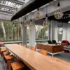 Modern indoor dining area with tropical view.