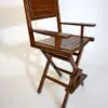 Wooden director's chair with folding design.