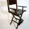 Wooden folding director's chair on white background.