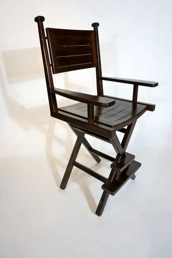 Wooden folding director's chair on white background.