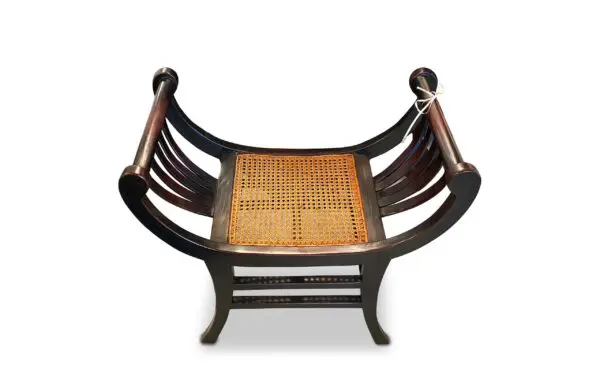 Traditional wooden chair with woven seat.