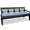Black wooden bench with blue cushion.