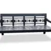Black decorative wooden bench with floral design.