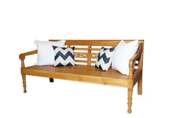 Wooden bench with decorative pillows.