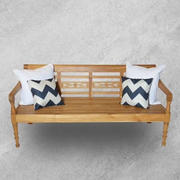 Wooden bench with decorative pillows.