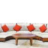 A couch with pillows and a coffee table
