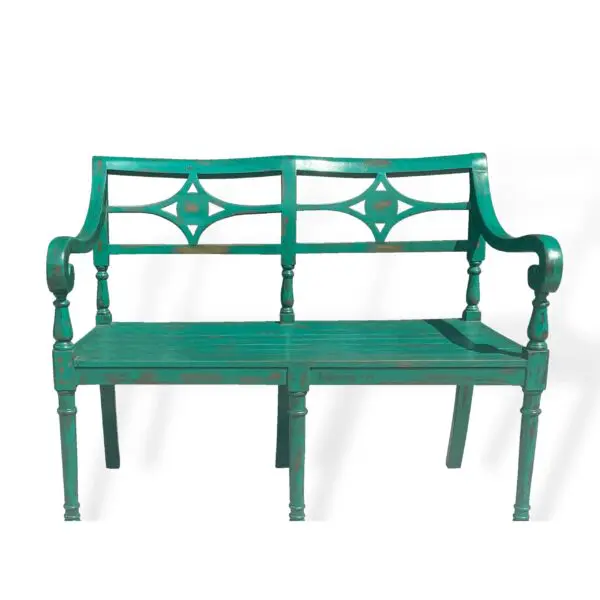 Vintage green wooden bench with decorative backrest.