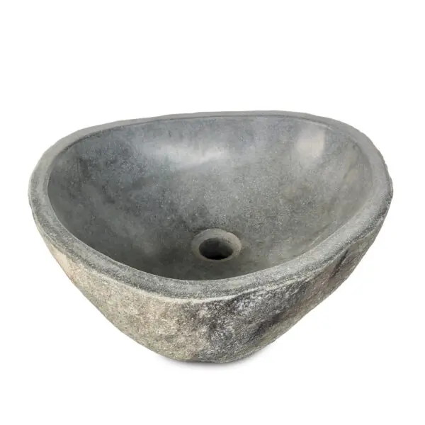 A gray stone sink with a hole in the middle.