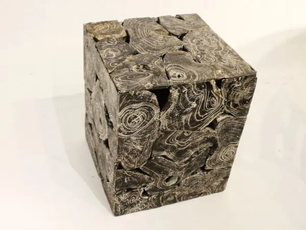 Abstract textured cube with layered design.