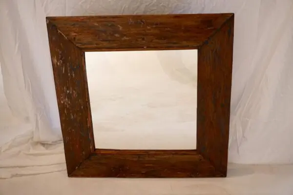 Rustic wooden mirror with a simple frame.