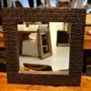 Decorative mirror with wooden frame.