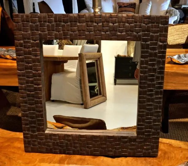 Decorative mirror with wooden frame.