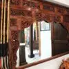 Ornate wooden mirror with decorative carvings.