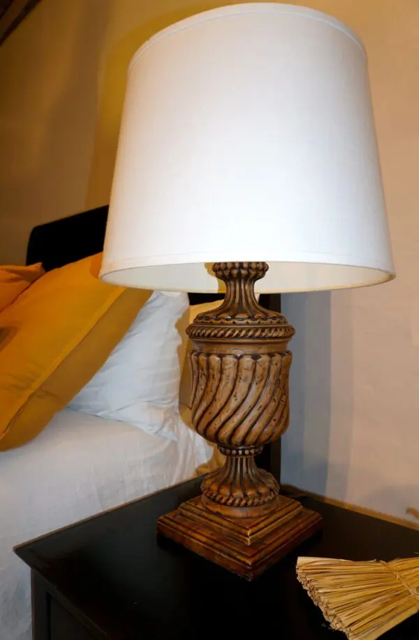 Decorative lamp on bedside table.