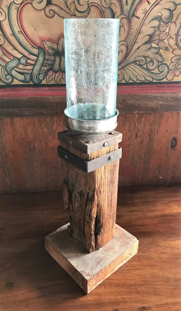 A mason jar sitting on top of a wooden stand.