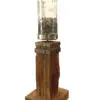 A wooden pillar with a glass cylinder on top.
