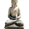 Stone Buddha statue seated in meditation.