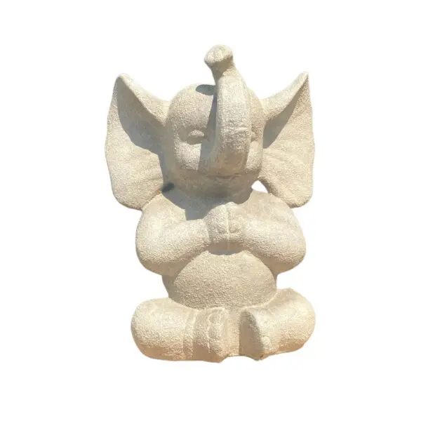 Stone elephant statue in a sitting pose.