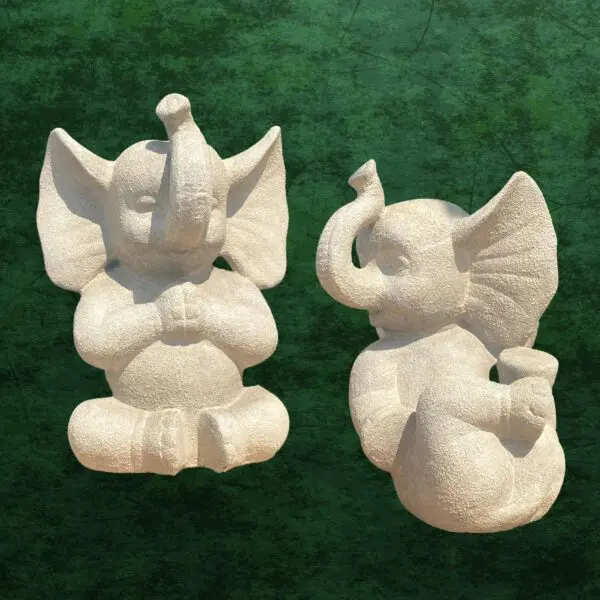 Two cute stone elephant sculptures.