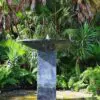 Modern fountain in a tropical garden.
