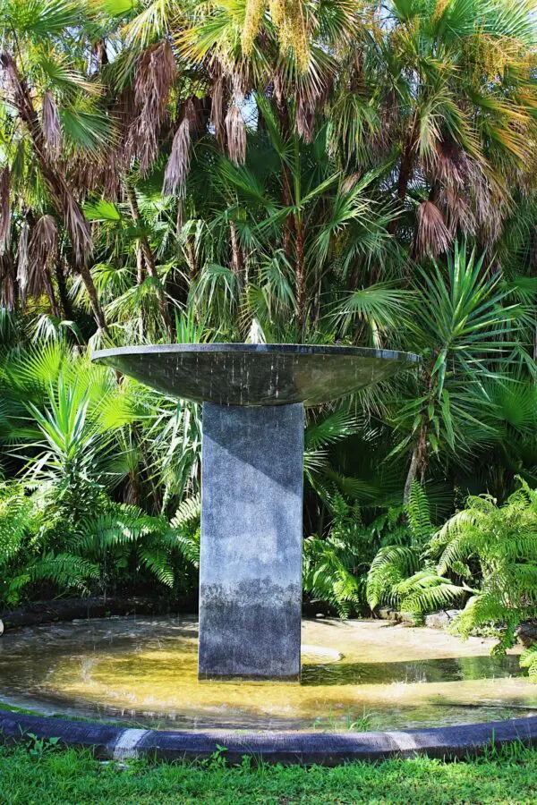 Modern fountain in a tropical garden.