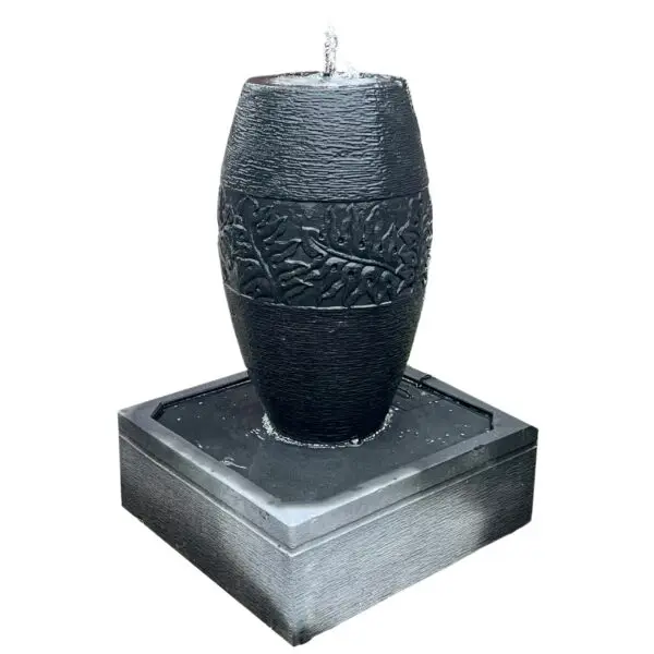 Decorative black water fountain with design.