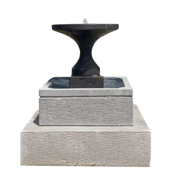 Black fountain on gray stone base.