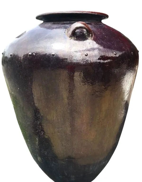 Dark, glossy ceramic jar with handle.