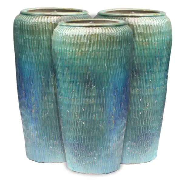 Three tall, textured blue-green vases.