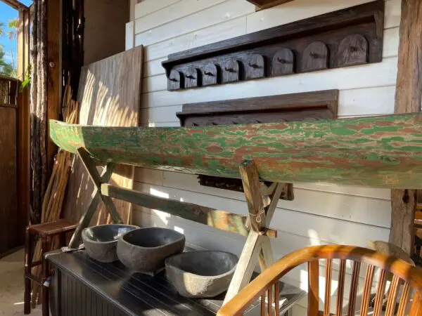 A wooden beam sitting on top of a table.